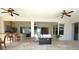 Bright open living room featuring tile floors, ceiling fans, and a clear view to the kitchen at 8121 Snowy Egret Pl, Bradenton, FL 34202