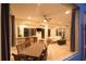 A spacious covered patio features an outdoor kitchen, dining area, and lounge seating with a cozy fire pit at 8121 Snowy Egret Pl, Bradenton, FL 34202