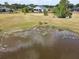 Backyard view of a pond and home at 8121 Snowy Egret Pl, Bradenton, FL 34202