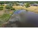 Aerial view of a backyard pond, and surrounding properties at 8121 Snowy Egret Pl, Bradenton, FL 34202