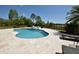 Inviting pool with a rock feature and a view of the lake at 8121 Snowy Egret Pl, Bradenton, FL 34202