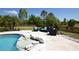 Seating on the patio with a water feature and a view of the lake at 8121 Snowy Egret Pl, Bradenton, FL 34202