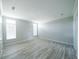 Bright bedroom features wood-look flooring and ample natural light at 8226 Sweden Blvd, Punta Gorda, FL 33982