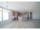 Kitchen with island and seating provides an open view of the dining and living areas at 8226 Sweden Blvd, Punta Gorda, FL 33982
