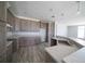 Open kitchen with stainless steel sink, laminate countertops, and wood cabinets at 8226 Sweden Blvd, Punta Gorda, FL 33982