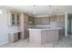 Spacious kitchen features an island with countertop seating, pendant lights, and ample cabinet space at 8226 Sweden Blvd, Punta Gorda, FL 33982
