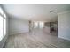 Expansive open-concept living room with wood flooring and a view of the kitchen at 8226 Sweden Blvd, Punta Gorda, FL 33982