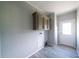 This mud room features wood-look floors and overhead cabinets at 8226 Sweden Blvd, Punta Gorda, FL 33982