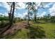 The property has a tree-lined boundary at 8226 Sweden Blvd, Punta Gorda, FL 33982
