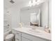 Well-lit bathroom featuring a combined tub and shower, toilet, and a large vanity at 8545 Daybreak St, Sarasota, FL 34241