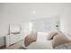 Bright bedroom features neutral decor, double windows, and a spacious closet at 8545 Daybreak St, Sarasota, FL 34241