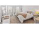 Bright bedroom with neutral tones, plush carpet, and natural light at 8545 Daybreak St, Sarasota, FL 34241