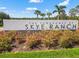 Welcome to Skye Ranch! Decorative landscaping around the community sign at The Townhomes at Skye Ranch at 8545 Daybreak St, Sarasota, FL 34241