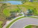 Aerial of the dog park divided into two sections near a lake and featuring benches and pet-friendly agility equipment at 8545 Daybreak St, Sarasota, FL 34241