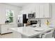 Bright kitchen featuring quartz countertops and stainless steel appliances at 8545 Daybreak St, Sarasota, FL 34241