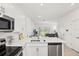 Stainless steel appliances including microwave and electric range in the modern kitchen at 8545 Daybreak St, Sarasota, FL 34241