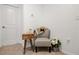 Cozy corner sitting area featuring a chair, side table, and stylish decorative accents at 8545 Daybreak St, Sarasota, FL 34241