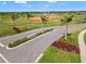 Roadside view of Turner Park at Skye Ranch entrance with neatly manicured landscaping and palm trees at 8545 Daybreak St, Sarasota, FL 34241