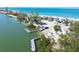 View of the beach with a boat launch and parking near the water at 8911 Midnight Pass Rd # 308, Sarasota, FL 34242