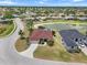 Aerial view of the community, showcasing the home's location and proximity to a pond at 9012 Province St, Sarasota, FL 34240