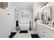Elegant bathroom featuring a soaking tub, modern fixtures, and a serene design for relaxation at 9012 Province St, Sarasota, FL 34240