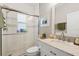 Well-lit bathroom with a modern glass shower, updated vanity, and a decorative shower at 9012 Province St, Sarasota, FL 34240