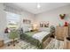 Sunlit bedroom featuring a desk, cozy bed, and outdoors themed decor at 9012 Province St, Sarasota, FL 34240