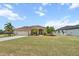Charming single-story home boasting a two-car garage, lush yard, and well-kept lawn at 9012 Province St, Sarasota, FL 34240