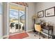 Bright home office with a desk, comfortable chair, and a view of the outdoor pool area at 9012 Province St, Sarasota, FL 34240