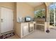 Outdoor kitchen with marble countertops, stainless steel grill, sink, and mini refrigerator at 9012 Province St, Sarasota, FL 34240