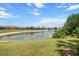 Scenic pond view with lush greenery, offering a serene backdrop at 9012 Province St, Sarasota, FL 34240