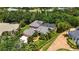 An appealing exterior shot of a well-maintained property with a tile roof and a screened-in pool at 9915 Old Hyde Park Pl, Bradenton, FL 34202