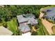 An appealing exterior shot of a well-maintained property with a tile roof and a screened-in pool at 9915 Old Hyde Park Pl, Bradenton, FL 34202