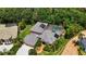 An appealing exterior shot of a well-maintained property with a tile roof and a screened-in pool at 9915 Old Hyde Park Pl, Bradenton, FL 34202