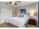 Inviting bedroom featuring a queen bed with decorative pillows and coastal-themed artwork at 9915 Old Hyde Park Pl, Bradenton, FL 34202