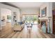 Inviting living room with fireplace, hardwood floors, and sliding glass doors to the pool area at 9915 Old Hyde Park Pl, Bradenton, FL 34202