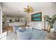 Bright living room features an open floor plan, stylish furniture, and modern ceiling fan at 9915 Old Hyde Park Pl, Bradenton, FL 34202