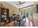 Bright office space with hardwood floors, french doors, and built in shelving at 9915 Old Hyde Park Pl, Bradenton, FL 34202