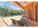 Screened-in pool area with comfortable seating and lush landscaping surrounding a sparkling pool at 9915 Old Hyde Park Pl, Bradenton, FL 34202