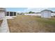 Backyard with shed and a screened in porch offers the perfect blend of comfort and nature at 1007 Southern Pine Ln, Sarasota, FL 34243