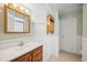 Traditional bathroom featuring a wood vanity with a medicine cabinet and a shower/tub at 1007 Southern Pine Ln, Sarasota, FL 34243