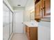 Well-lit bathroom with a shower and tub combination, complemented by a traditional vanity with storage at 1007 Southern Pine Ln, Sarasota, FL 34243
