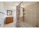 Bathroom features a tiled shower, vanity with storage, and ample lighting at 1007 Southern Pine Ln, Sarasota, FL 34243