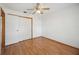 Bedroom features sleek wood floors and ample closet space, designed for comfort and style at 1007 Southern Pine Ln, Sarasota, FL 34243