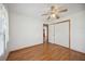 Bedroom featuring hardwood floors, ceiling fan and a closet for ample storage at 1007 Southern Pine Ln, Sarasota, FL 34243