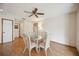 Inviting dining area with a ceiling fan and laminate flooring at 1007 Southern Pine Ln, Sarasota, FL 34243
