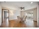 Cozy dining area with laminate flooring and access to a screened-in lanai at 1007 Southern Pine Ln, Sarasota, FL 34243