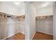 Spacious walk-in closet featuring ample hanging space and built-in shelving, ideal for organization and storage at 1007 Southern Pine Ln, Sarasota, FL 34243