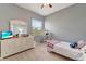 Bright and airy bedroom featuring a dresser, a TV, and a cozy bed, creating a serene retreat with ample natural light at 11 Lateen Sail Dr, Placida, FL 33946