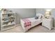 Serene bedroom featuring a bed, bookshelf, and nightstand, designed for restful nights and tranquil mornings at 11 Lateen Sail Dr, Placida, FL 33946